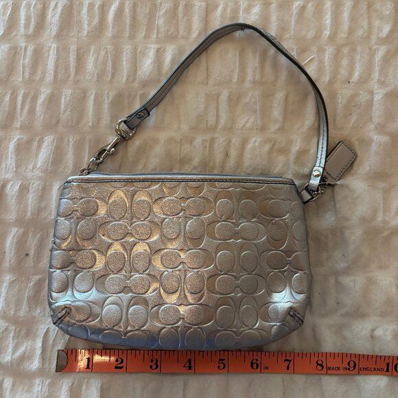 Authentic Coach Metallic Silver Wristlet with Heart Charm - Picture 2 of 5